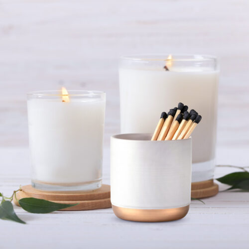 scented candles on white background